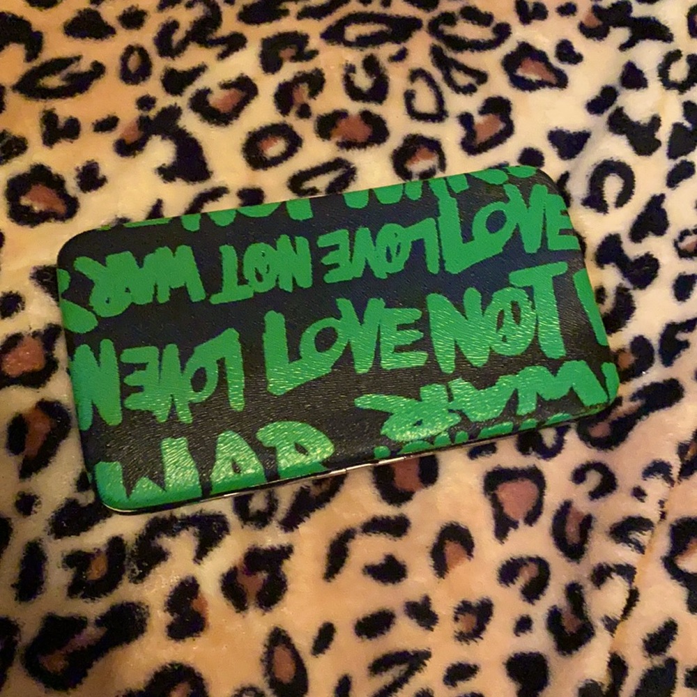 3/$10 SALE 🌈 Retro “Love Not War” wallet